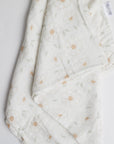White Daisy Swaddle on white background.
