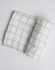 Sage Green Window Pane Swaddle on white background.