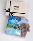 BOXFOX New Baby Boy Box in creme, including a swaddle, elephant rattle, teether, hat and book.