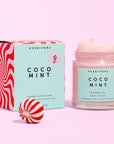 COCO Mint Body Scrub by Herbivore on Pink Background