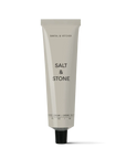 gray aluminum hand lotion container with black text and a black cap