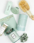 DETOX bath salts, large candle, dry brush, collagen face mask, hand cream, scalp scrubber, silk scrunchie and hair towel.