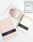 Wit & Delight Pink Note to Self Journal, BOXFOX Pink Ceramic Mug, Well-Kept Hampton Tech Wipes, Sugarpaper Pink To Do Pad, and BOXFOX Pink Bullet Pen.