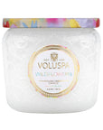 White glass jar with colorful metallic lid. Wildflowers Voluspa Candle.