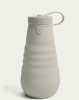 oat colored stojo bottle on white background