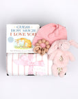 BOXFOX black gift box next to open box containing a book, swaddle, teether, baby beanie and bunny rattle.