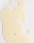 Hair Oil out of packaging on white background