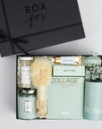The GREEN GODDESS gift box in black, including DETOX bath salts, large candle, dry brush, collagen face mask, hand cream, scalp scrubber, silk scrunchie and hair towel.
