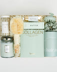 The GREEN GODDESS gift box in creme, including DETOX bath salts, large candle, dry brush, collagen face mask, hand cream, scalp scrubber, silk scrunchie and hair towel.