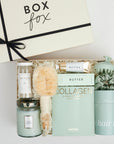 The GREEN GODDESS gift box in creme, including DETOX bath salts, large candle, dry brush, collagen face mask, hand cream, scalp scrubber, silk scrunchie and hair towel.