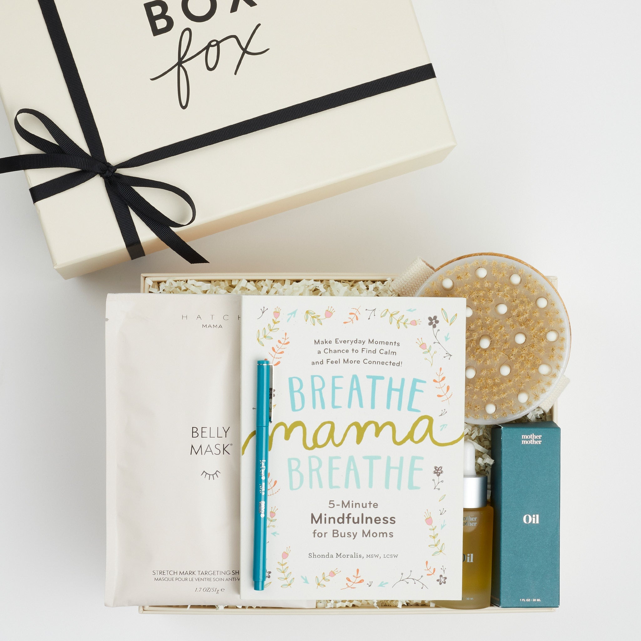BOXFOX Creme Gift Box filled with "Breathe Mama Breathe" Book, Le Pen Teal Pen, Mother Mother Belly Oil, HATCH Belly Sheet Mask , and BOXFOX Round Dry Brush