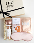 BOXFOX Creme Gift Box filled with Azeria Pink Silk Sleep Mask, Herbivore Botanicals Calm Bath Salts, Voluspa Prosecco Rose Candle, Lapcos Pearl Sheet Mask and The Chocolate Society Chocolate Bar