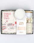 Table for Two ready to ship in black featuring "Table for Two" cookbook, Le Creuset spoon rest, Branche olive oil, The Salt, and marble salt cellar