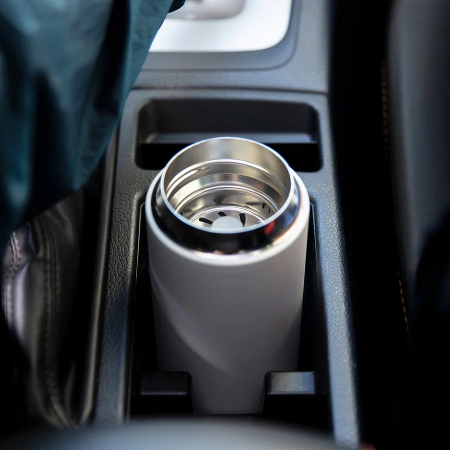 Move mug in car cup holder.