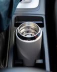 Move mug in car cup holder.