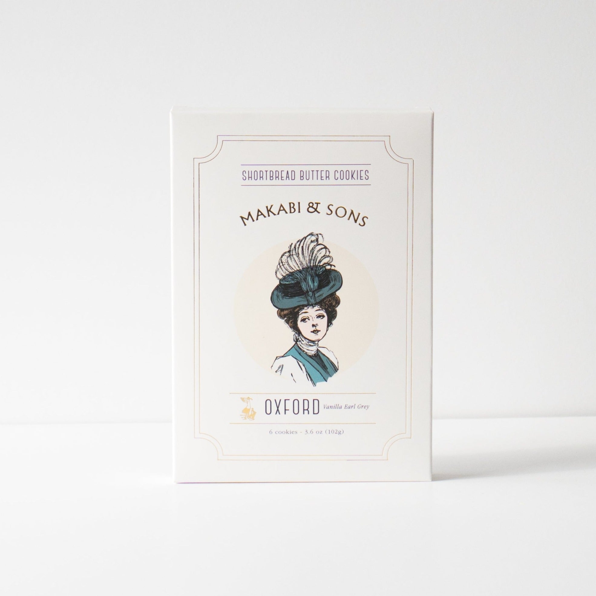 Makabi + Sons Oxford Early Grey Shortbread cookies with graphic of woman wearing regal blue hat on white box.