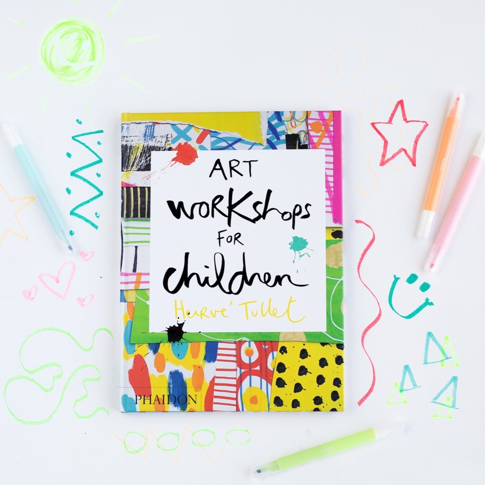 Art Workshops for Children book photographed on white paper with colorful doodles around the book.