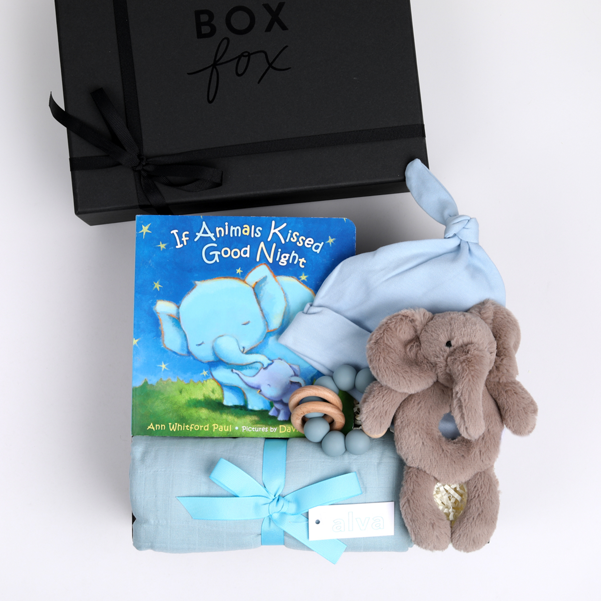 BOXFOX New Baby Boy Box in black, including a swaddle, elephant rattle teether, hat and book.