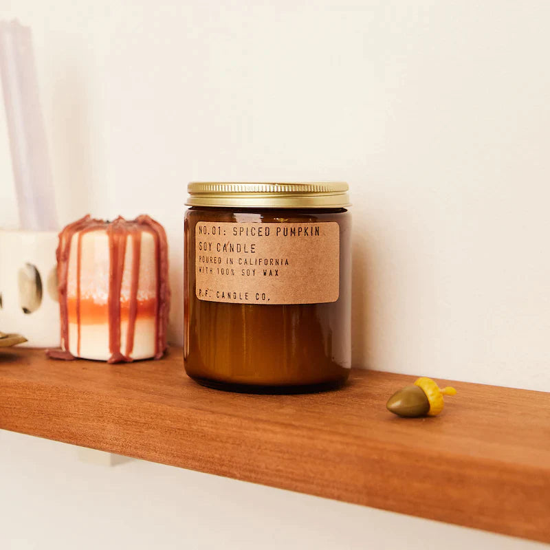 Spiced Pumpkin 7.2 oz Soy Candle on shelf next to candle and acorn