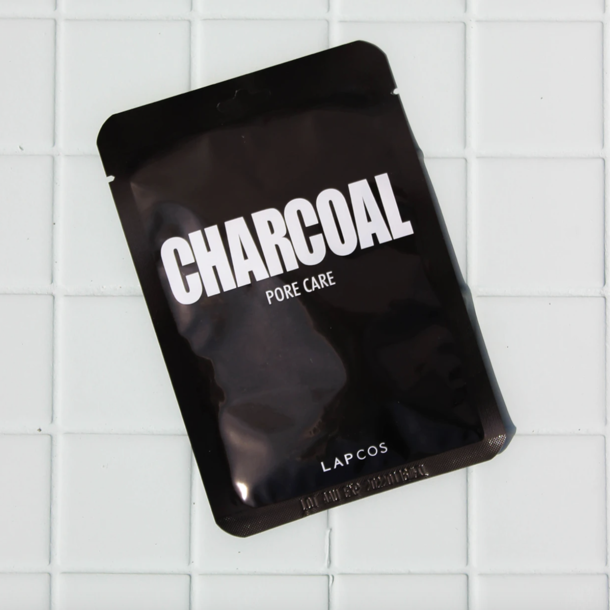 charcoal face mask, black rectangular shiny flat package