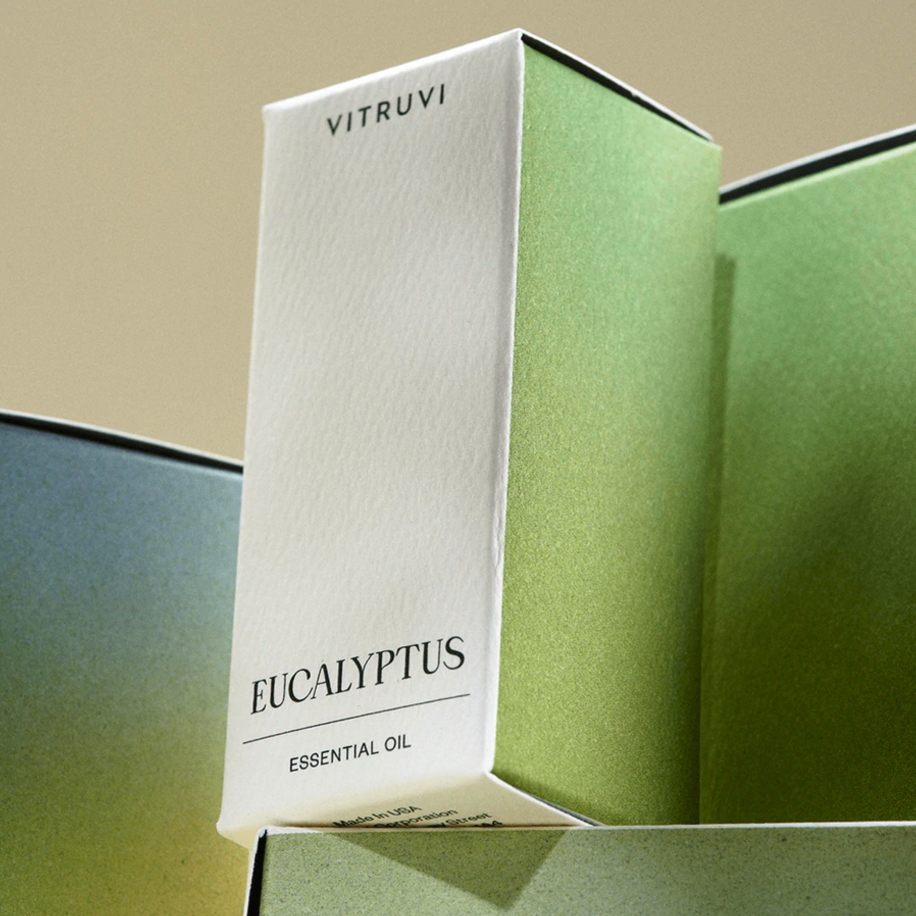 White and green box with &quot;VITRUVI EUCALYPTUS ESSENTIAL OIL&quot; written on the front.