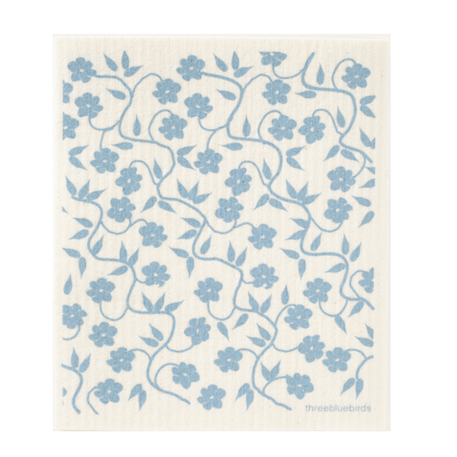 Square, off-white dish towel with light blue floral/ vine design photographed on white background