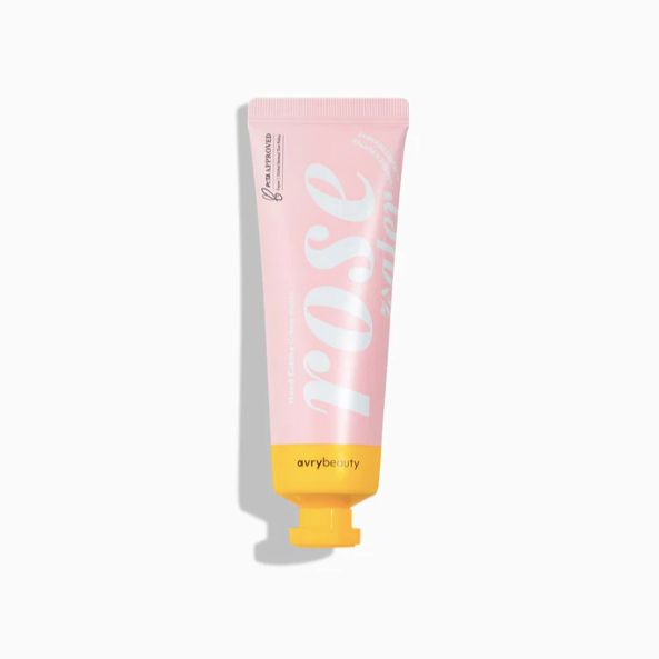 A pink squeeze tube with yellow end and cap. Photographed on white background.