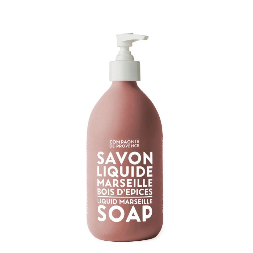 Red glass bottle container for the liquid soap. Hand pump is white and the text with the brand and name of the soap printed in white