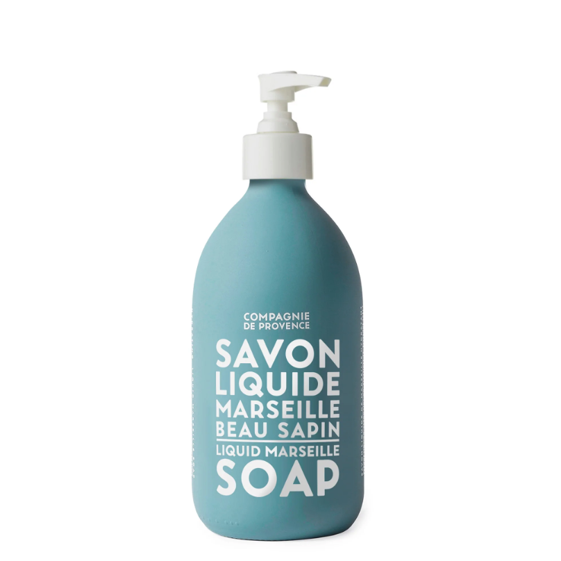 Light blue soap bottle with white pump to dispense hand soap. Soap bottle has white text printed on the front that reads &quot;Savon LIquide Marseille Beau Sapin&quot;