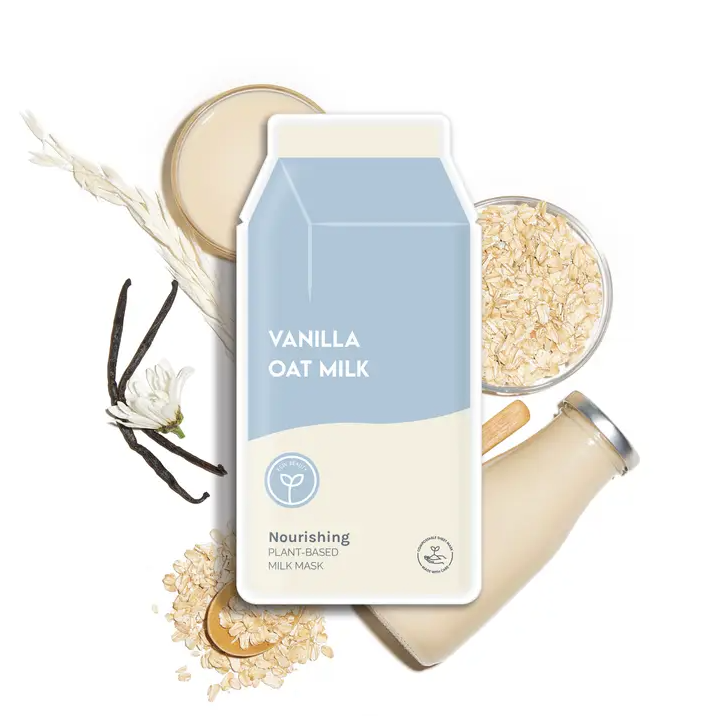 ESW Vanilla Oat Milk Nourishing Plant-Based Milk Sheet Mask on top of bottle of milk, oats and vanilla bean