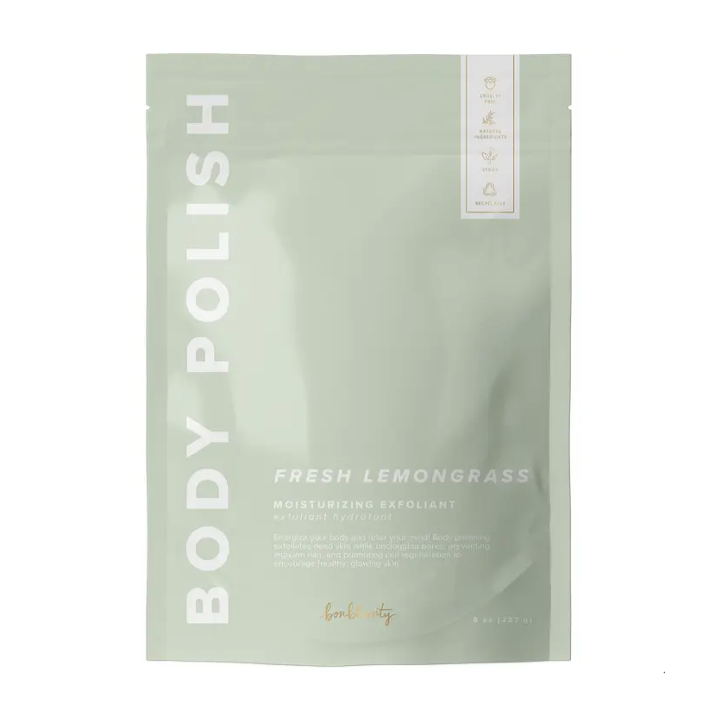 A light green resealable plastic bag with white text that reads, "Fresh Lemongrass Body Polish Moisturizing Exfoliant" photographed on white background