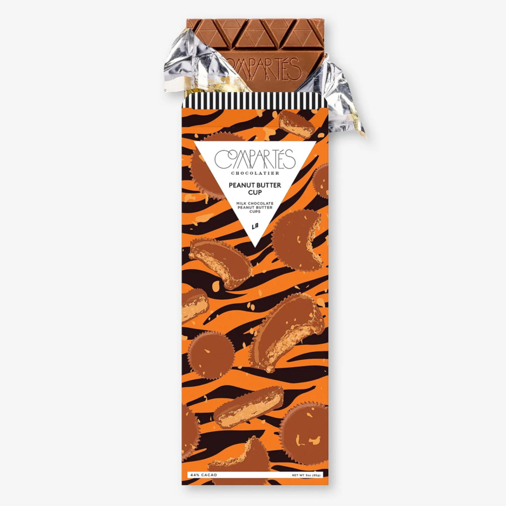 Peanut Butter Cup Chocolate Bar in orange and black tiger stripe packaging on white background.