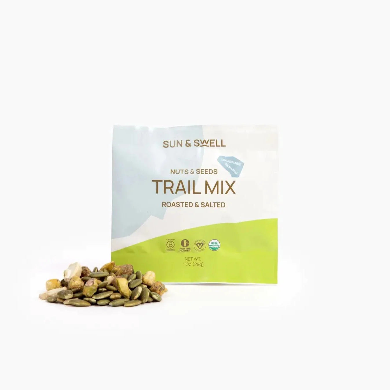 Trail mix and its compostable bag against a white background