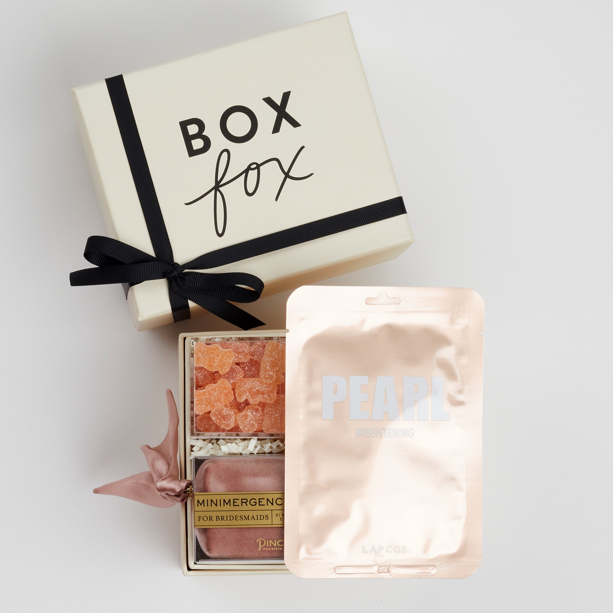 BOXFOX Bridesmaid Gift Box in Creme box with Lapcos Pearl Brightening Mask, Sugarfina sparkling pink gummies, Pinch Provisions pinch velvet bridesmaids essential kit