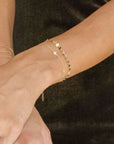 Petite CZ Bracelet on wrist with other bracelets 