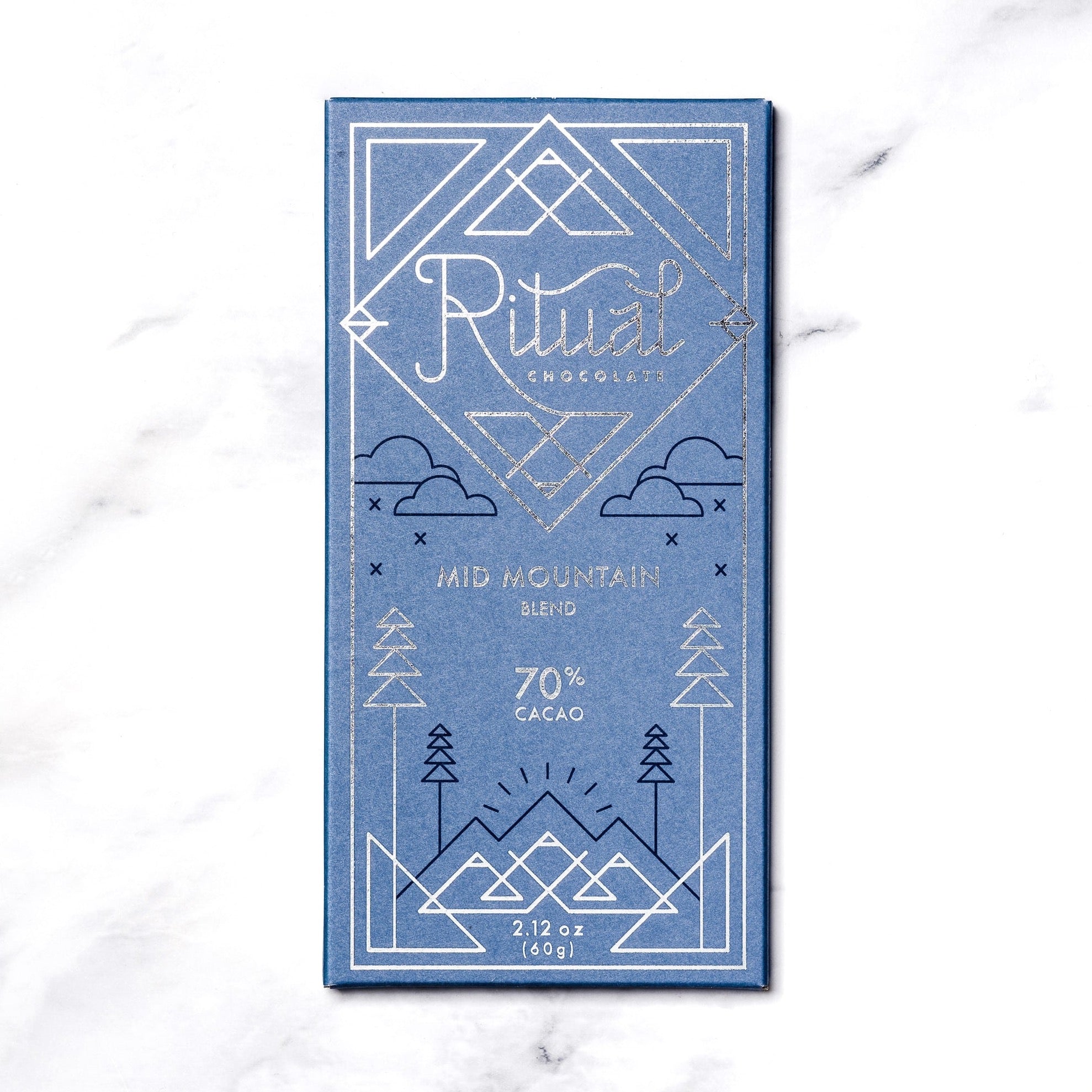 Ritual Chocolate bar in blue packaging and silver writing that says &quot;Mid Mountain blend 70% Cacao&quot;