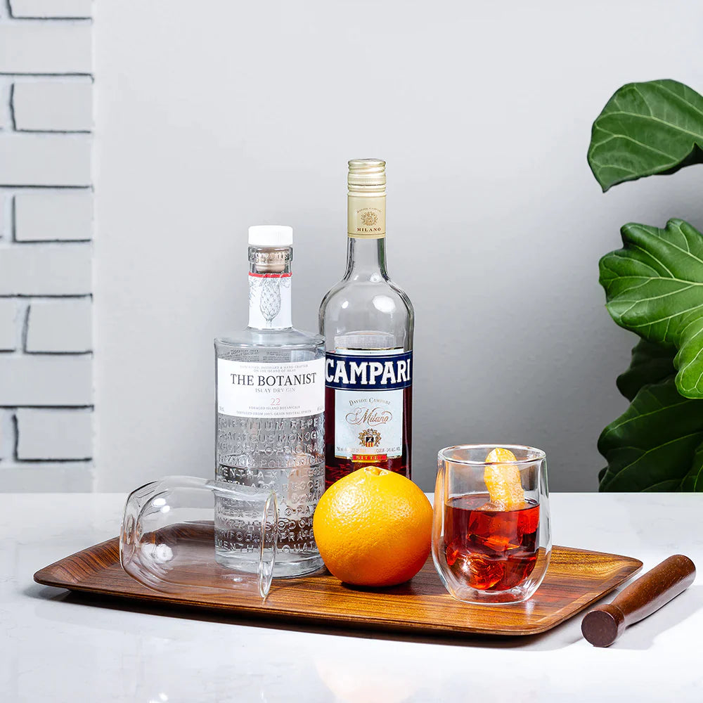 Clear Stemless Glasses (Set of 2) on tray with orange, gin and campari