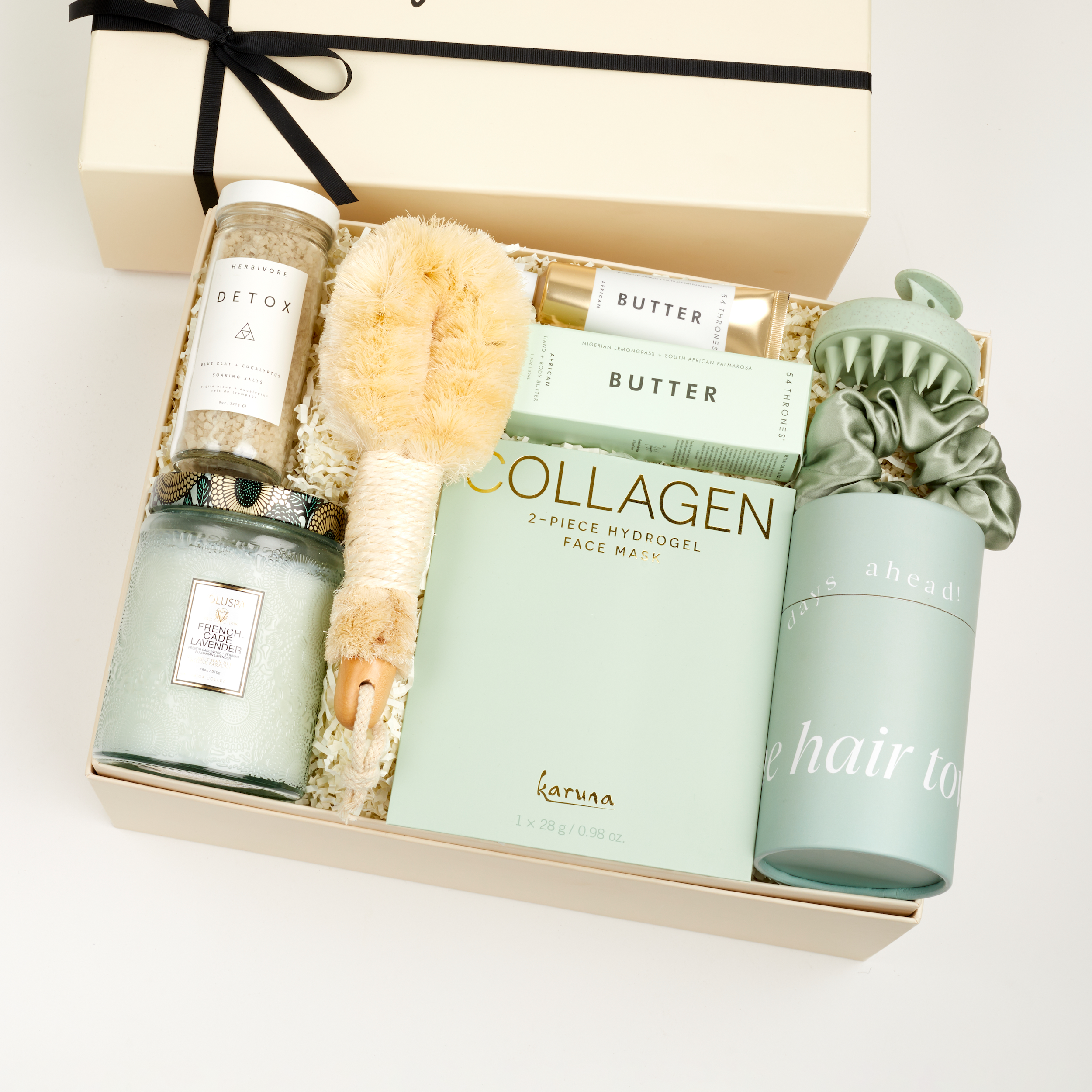 The GREEN GODDESS gift box in creme, including DETOX bath salts, large candle, dry brush, collagen face mask, hand cream, scalp scrubber, silk scrunchie and hair towel.