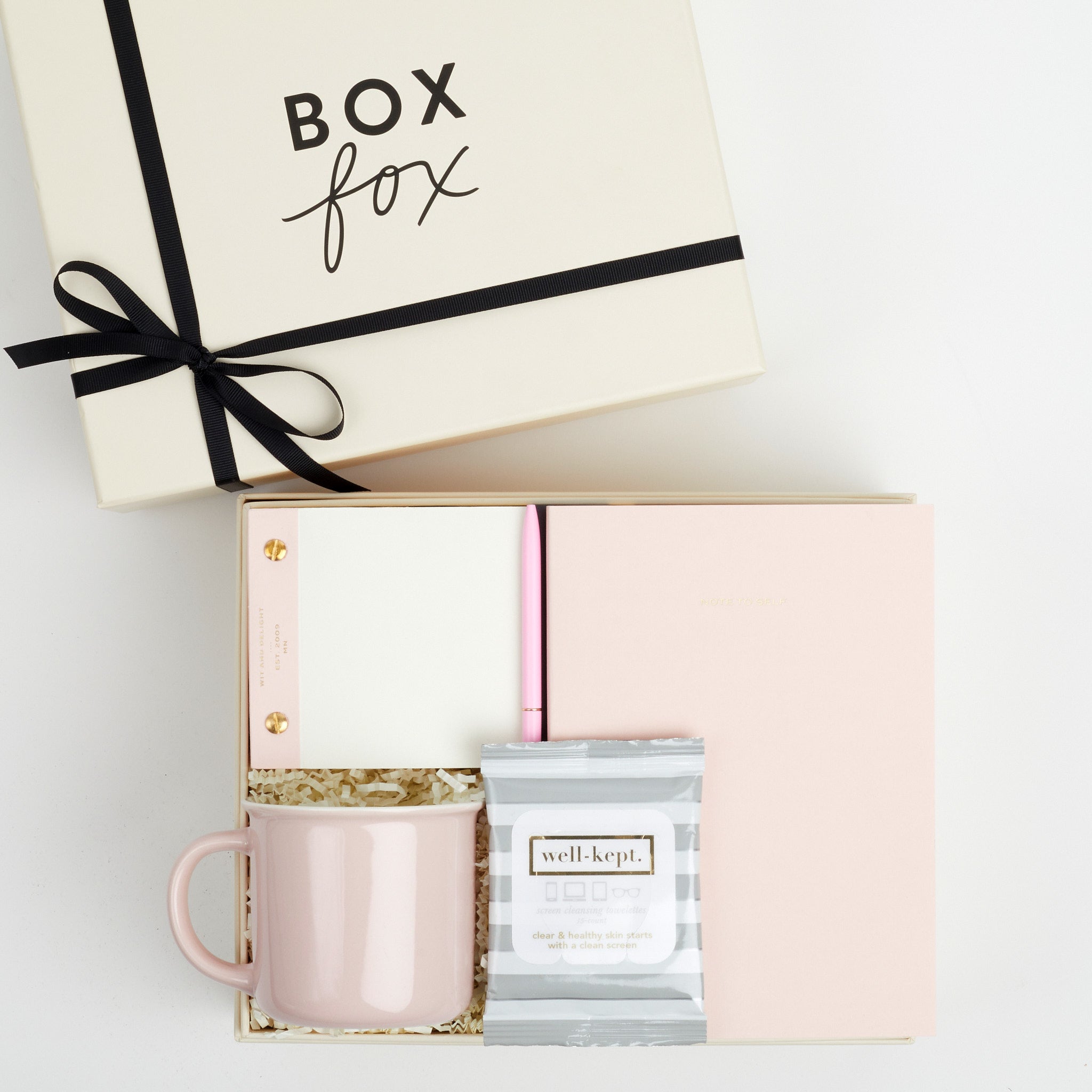 BOXFOX Original Creme Hustle Gift Box packed with Wit &amp; Delight Pink Note to Self Journal, BOXFOX Pink Ceramic Mug, Well-Kept Hampton Tech Wipes, Sugarpaper Pink To Do Pad, and BOXFOX Pink Bullet Pen.