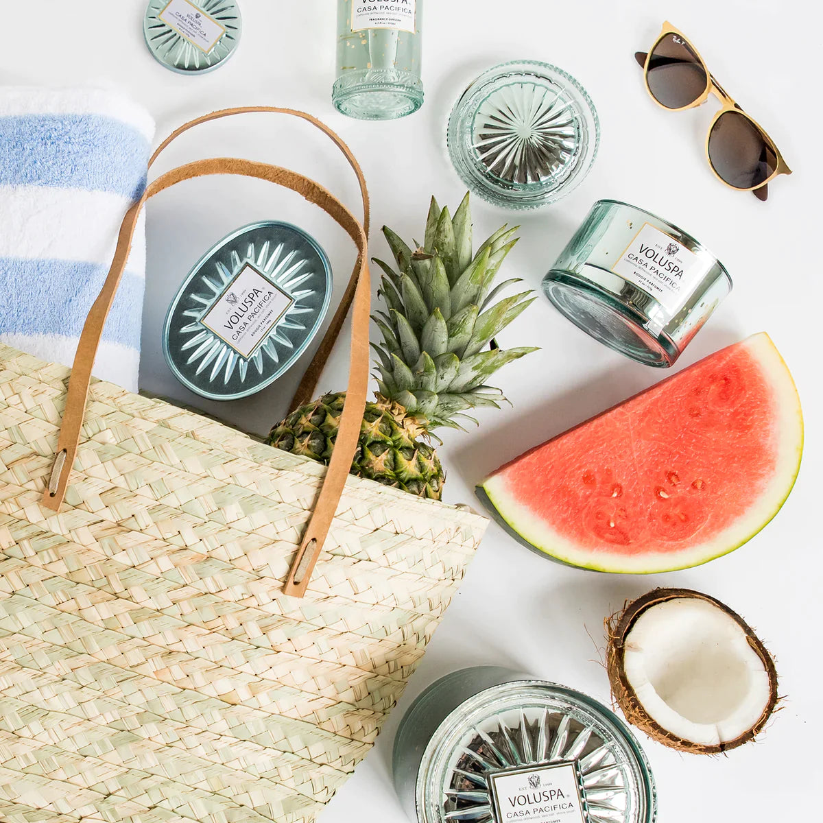 woven bag with pineapple, watermelon, towel surrounded by Casa Pacifica collection.