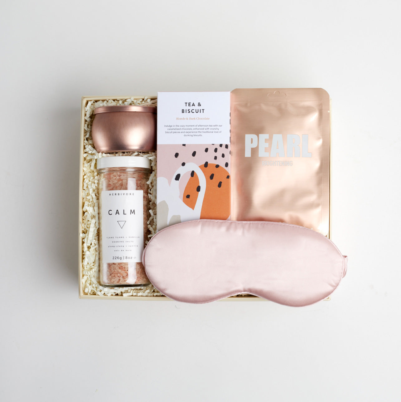 BOXFOX Creme Gift Box filled with Azeria Pink Silk Sleep Mask, Herbivore Botanicals Calm Bath Salts, Voluspa Prosecco Rose Candle, Lapcos Pearl Sheet Mask and The Chocolate Society Chocolate Bar