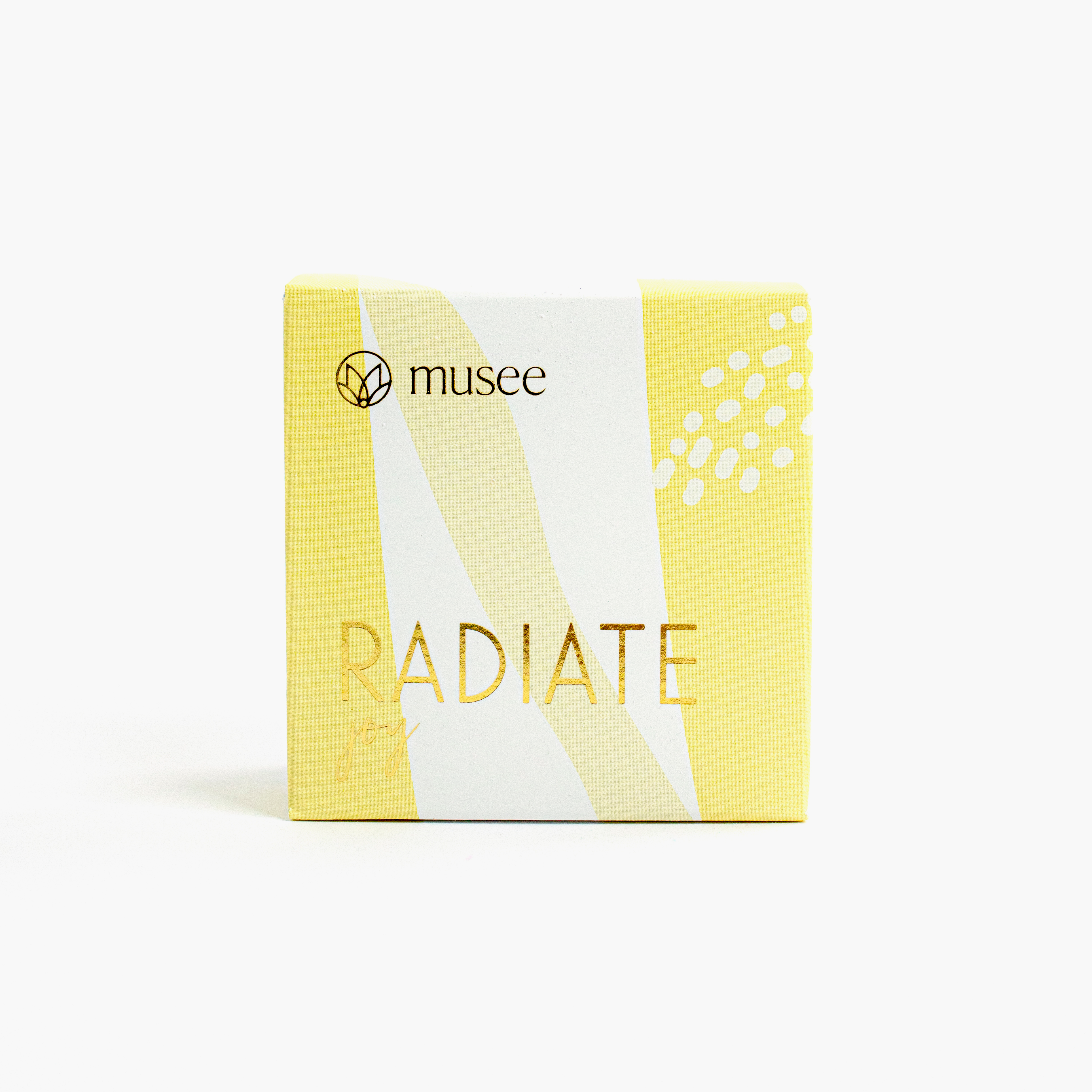 Yellow box of soap with Gold Foil reading RADIATE Joy