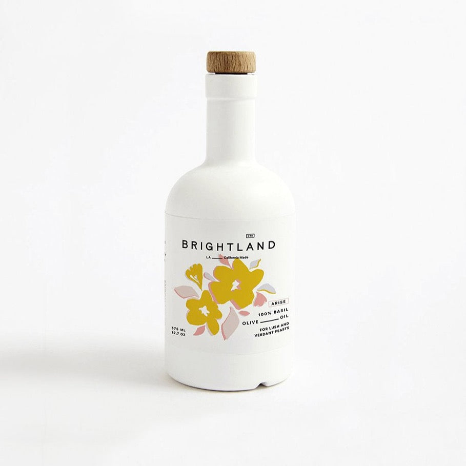white ceramic bottle with yellow flowers printed on the bright land label.